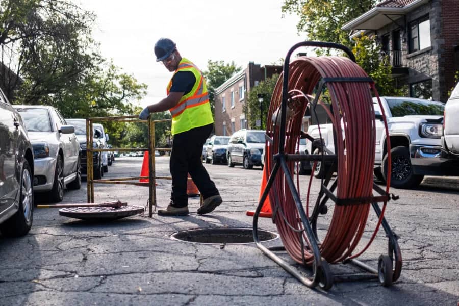 JFA technician preparing to insert the liner from the street manhole